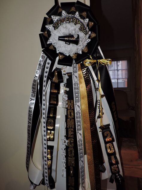 Cheer Black, gold & white Homecoming mum Black And Gold Mums For Homecoming, Black Gold And White Homecoming Mums, White Homecoming Mum, Cheer Black, Big Homecoming Mums, Hoco 2022, Homecoming Mums Senior, Hoco Mums, Football Homecoming