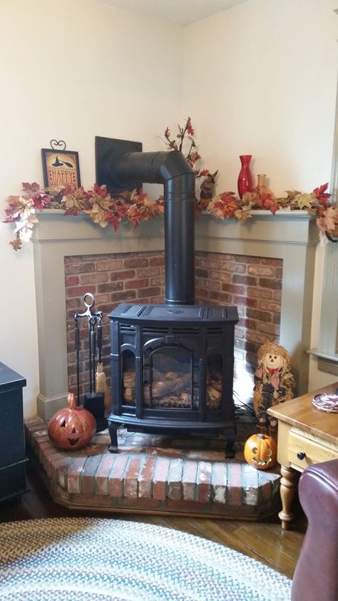 Mantel With Wood Stove, Faux Wood Stove Surround, Mantel Over Wood Stove, Wood Stove Tv Above, Corner Stove Fireplace Ideas, Wood Burning Stove Corner Ideas, Corner Wood Stove Mantle, Corner Wood Stove Mantel Ideas, Corner Wood Stove Mantel