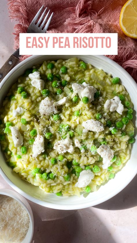 Overhead view, green pea risotto topped with dollops of ricotta, fresh peas, salt and pepper