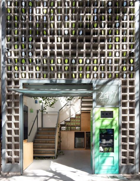 Natural materials fill Desinchá tea shop in São Paulo by SuperLimão Retail Architecture, Gabion Wall, Beer Hall, Staircase Railings, Steel Lighting, Amazing Spaces, Retail Interior, Interior Photography, Concrete Blocks