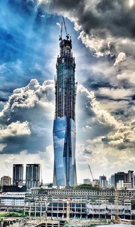 By Al Anvari, P.E. In 2015, when the project team was confronted with the complex constructability challenges and confinement reinforcement design issues for the construction of the world’s 2nd tallest building, they turned to BauGrid Reinforcement for solution. This extraordinary project, Merdeka PNB-118 (aka PNB-118), is a 118-story, 644 m (2,113 ft) tall Skyscraper that […] The post BauGrid® Reinforcement Enables the World’s Second Tallest Building to Soar into the Skies of Kuala Lumpur… Pnb 118, Dubai Creek Tower, Jeddah Tower, Power And Authority, Dubai Creek, Structural Engineer, Singapore Photos, Story Building, Civil Services