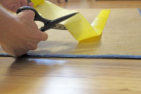 Rugs that slip and slide are unattractive and dangerous. Learn 11 ways to keep rugs from sliding from types of rug pads to tape to silicone caulking. Rug Hacks, Polyurethane Floors, Diy Hardwood Floors, Make A Rug, Homemade Rugs, Rug Gripper, Rugs Slipping, Hack My Life, Rug Tape