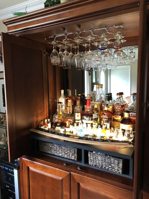 Originally a TV armoire; we’ve repurposed it to be a bar Tv Cabinet Bar Ideas, Armoire To Bar Makeover, Tv Stand To Bar Cart, Tv Cabinet Bar, Armoire Bar Makeover, Armoire Liquor Cabinet, Liquor Cabinet Makeover, Bar Armoire Repurposed, Tv Armoire Repurposed Bar Liquor Cabinet