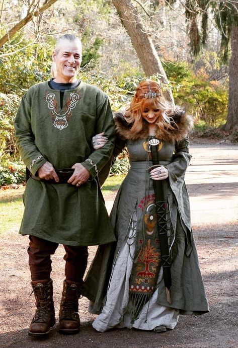 matching garments for bride and groom, viking inspired design, pagan design, celtic design, medieval design, viking woman, viking men, mens viking tunic, mens medieval shirt, matching costume for themed weddings, 3 layers dress, fantasy dress, sustainable fashion, linen garments, personalized design and embroidery, tribal dress, renaissance wedding, ren faire wedding, green medieval dress, white viking dress, green norse gown, green celtic dress, green elven dress, corset dress, plus size dress Viking Costume Women, Pagan Dress, Viking Wedding Dress, Norse Clothing, Celtic Pagan, Costume Viking, Celtic Dress, Celtic Clothing, Pagan Clothing