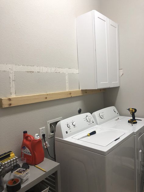 A laundry room with white wall cabinets being installed. Cabinet Installation Diy, Diy Laundry Room Cabinets, Blooming Nest, Mudroom Laundry Room, Organizational Ideas, Shaker Style Cabinets, Built In Cabinet, Laundry Room Cabinets, Laundry Room Inspiration