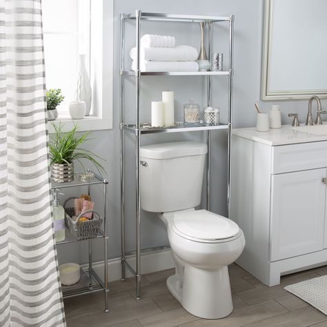 "Shop Organize It All 3-Tier Glass Shelf Space Saver at Michaels. com. Designed with 3 sturdy shelves that conveniently fit over the toilet creating more storage space. Create more space in your bathroom with this 3-tier space saver. Designed with 3 sturdy shelves that conveniently fit over the toilet creating storage space. Shelves can be used to hold towels, toiletries, bath products and décor. Details: Silver and clear 24.25\" x 10.75\" x 63.5\" Fits over toilet Includes 3 shelves Made with m Bathroom Under Sink Storage, Bathroom Cabinets Over Toilet, Creating Storage, Bathroom Under Sink, Shelves Above Toilet, Over The Toilet Storage, Over The Toilet, Under Sink Storage, Over Toilet