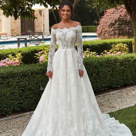 Penelope Wedding Dress by MoriLee The lovely A-line ball gown has an illusion bodice with an off-the-shoulder scalloped neckline in romantic Chantilly lace. www.confettiandlace.com Call to book your appointment: 017 0889 0353 #MoriLeeBridal #WeddingDressInspo #BridalFashion #ChantillyLace #BridalGown #WeddingDressShopping #BridalAppointment #BridalStyle #WeddingGown #BridalConsultation #LaceWeddingDress #2024bride #2024wedding Mori Lee Bridal, Madeline Gardner, Exquisite Gowns, Designer Bridal Gowns, Chantilly Lace, Perfect Wedding Dress, Designer Wedding, Bridal Shop, Bridal Boutique