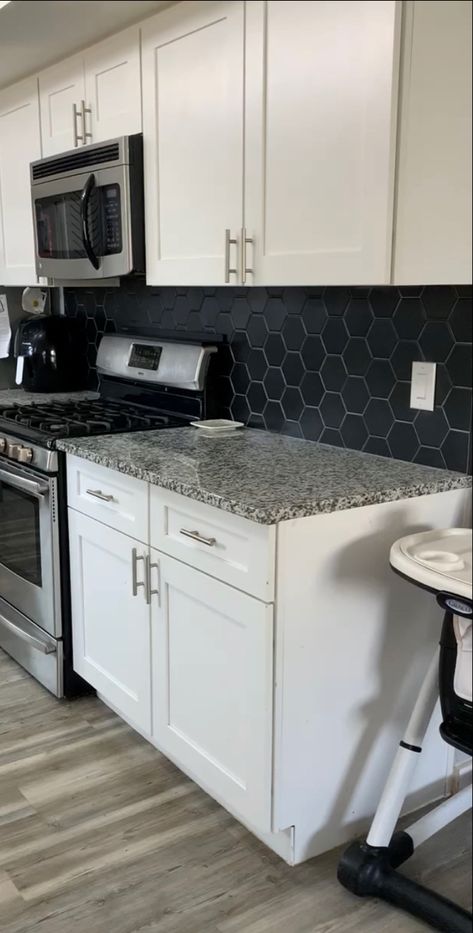 Never thought I would go with black in my kitchen but it really makes the kitchen. Black Backsplash With White Cabinets, Kitchen With Black Backsplash Ideas, Black Splash Kitchen, Black Kitchen Backsplash White Cabinets, White Cabinets With Black Backsplash, Black Back Splashback Kitchen Ideas, Kitchen Black Backsplash, White Cabinet Black Backsplash, Grey And Black Backsplash Kitchen