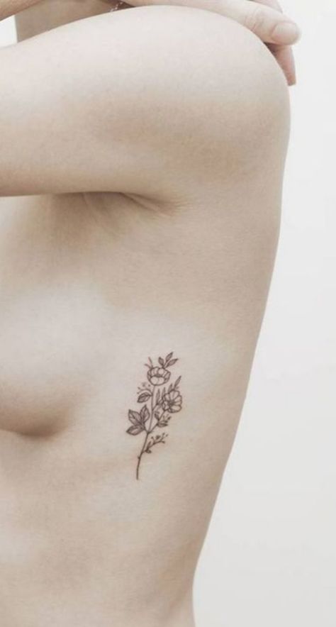 10 Of The Coolest Tattoo Designs You Should Totally Get - Society19 Flower Rib Tattoo, Flower Tattoo On Ribs, Flower Tattoo On Side, Sunflower Tattoo Shoulder, Tattoos For Women Flowers, Small Flower Tattoos, Best Tattoos For Women, Simple Tattoo Designs, Geniale Tattoos