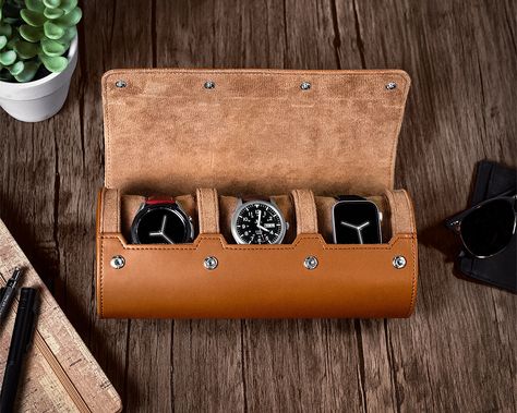 The Watch Roll Travel Case is a great example of how your watches would like to travel. Safe & protected within the soft, micro-suede walls of a rigid cylinder that […] Leather Watch Roll, Watch Safes, Watch Roll, Leather Roll, Hybrid Design, Leather Pillow, Recycled Leather, Leather Travel, Watch Collection