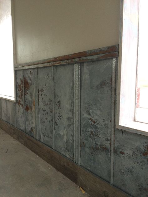 Acid washed metal wainscot being installed Metal Wall Panel Interiors, Metal Trim Wall, Industrial Wainscoting Ideas, Metal Wainscoting Ideas, Interior Metal Walls, Steel Accent Wall, Metal Wall Paneling, Metal Wainscoting, 1890 House