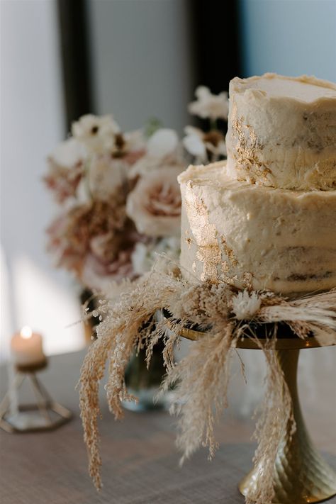 Rustic Ivory Boho Wedding Cake with Textured Frosting and Gold Leaf Details | Dried Flowers and Pampas Grass Cake Display Decor | Wedding Cake Designs Wedding Cakes Pampas, Boho Wedding Dessert Table Ideas, Wedding Cake With Pampas, Cake With Pampas, Boho Cake Table, Pampas Grass Wedding Cake, Pampas Grass Cake, Frosted Wedding Cake, Fall Baby Shower Cake