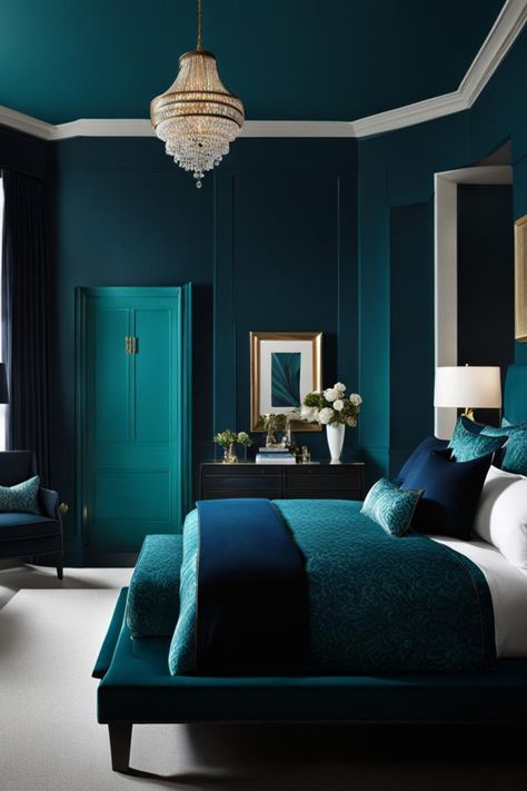 Envision a room in a dark teal, with a black wood bed frame and a velvet bench in navy blue at the foot. Light wood flooring and a cream area rug contrast the walls, with a gold-framed mirror adding sophistication. Blue Monochromatic Bedroom, Navy And Emerald Bedroom, Cyan Bedroom, Teal Headboard Bedroom, Teal Room Ideas, Navy And Teal Bedroom, Teal Bedroom Color Schemes, Teal Interior Design, Dark Teal Paint