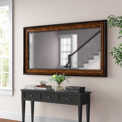 Use a double vanity wall mirror to make a bold statement in any space. This bronze and black demands attention with its large wooden frame and naturally distressed stunning design. Size: 73.25" H x 38.25" W Rectangle Mirror Wall Decor Living Room, Mirrors Ideas, Wall Mirror Decor Living Room, Entrance Mirror, Room Mirrors, Mirror Decor Living Room, Horizontal Mirrors, Room Mirror, Mirror Wall Living Room