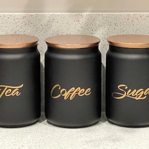 Luxury Kitchen Items, Black Kitchen Canisters, Black Kitchen Storage, Gold Kitchen Accessories, Tea Coffee Sugar Canisters, Black Kitchen Decor, Kitchen Storage Canisters, Idee Cricut, Sugar Canister