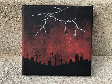 Halloween Cemetery painting with a lightning storm. Made with acrylic on a 6x6 inch stretched canvas. This painting makes the perfect wall art decor for the Halloween spirit:)  Sent with a free sticker and packed with care! :) Halloween Ghost Canvas Paintings, Mini Paintings Halloween, Scary Things To Paint On Canvas, Small Spooky Paintings, Cemetery Painting Easy, Mini Canvas Halloween Art, Easy Canvas Painting Halloween, Spooky Paint Night, Spooky Things To Paint