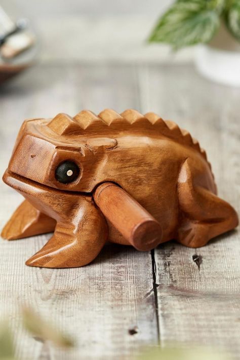 A carved acacia wood frog guiro. Wooden Frog, Hand Percussion, Percussion Instrument, Woodwind Instruments, Fun Fair, Carving Tools, Whittling, Musical Instrument, Acacia Wood