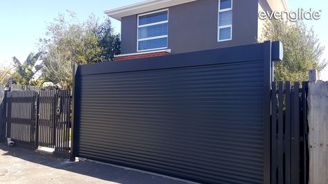 Door Outside, Roller Door, Overhead Garage Door, Overhead Garage, Steel Garage, House Ceiling Design, Roller Doors, Garage Walls, Backyard Fences