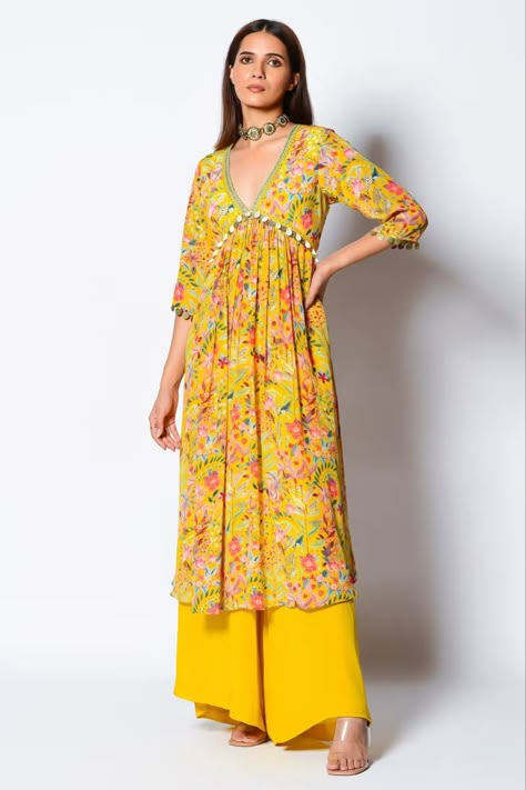 Buy #yellow A-line #kurta with floral motifs and hand embroidered neckline with shells and metallic coins. Comes with yellow #palazzo at #azafashions Shop online now at #Azafashions.com Call +12132135273 or email contactus@azafashions.com for enquiries. #wedding #festive #ethnic #tradional #shopping #shoponline #party #reception #bride Silk Outfit Aesthetic, Rishi Vibhuti, Kurta And Palazzo, Yellow Kurta, Kurta Palazzo Set, Stylish Kurtis Design, Dresses Traditional, Anarkali Dress Pattern, Marigold Yellow