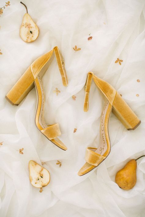 Gold Velvet Heels for a Chic Brice. Cozy Farmhouse Style for a Holiday Barn Wedding | Featured on Hey Wedding Lady. Shades of white and gold add rustic elegance. Natural textures of yellow flowers, succulent pears and amber cocktails transformed the barn venue at The Nest at Ruth Farms. Styled shoot by Ellen Ashton and Chancey Charm Dallas. Mustard Wedding, Yellow Wedding Inspiration, Velvet Block Heels, Grace Elizabeth, Weddings By Color, Boho Wedding Inspiration, Velvet Heels, Cozy Farmhouse, Yellow Wedding