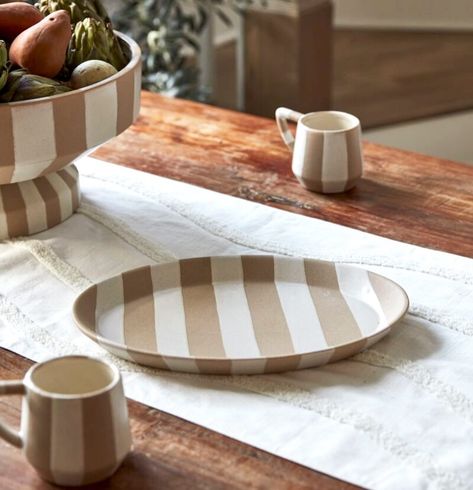 The Botera Serveware Collection, is a sophisticated yet playful ceramic collection featuring textured taupe and ivory stripes. A footed bowl, platter, butter dish, serving spoons, and mug create the finishing touches for your next dinner gathering with friends and family. . . . . . . . . . . . . . . . . . #dinnerware #dinner #tableware #tabledecor #serveware #kitchendecor #interiorideas #homedecorideas #homedecor #homedecoration Ceramic Platter, Platter Set, Ceramic Platters, Ceramic Set, Serving Utensils, Bath Furniture, White Glaze, Floor Mirror, Joss And Main