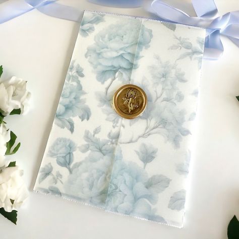 Introducing our Pre-folded Vellum Jackets: a touch of botanical elegance and luxury for your invitations. Crafted with premium vellum paper and delicate botanical designs, it adds sophistication and charm to your luxury event stationery. Wax seal stickers are sold SEPARATELY. Not sure if you want to make the commitment to investing in the vellum jackets prior to seeing them in person? No worries! Select "Sample" in the dropdown so that you can touch/feel and test it out first! Samples are also a Bunny Wedding, Light Blue Wedding Invitations, Wedding Invitation Blue, Floral Vellum, Blue Save The Date, Vellum Jacket, Event Stationery, Vellum Wrap, Blue And White Wedding