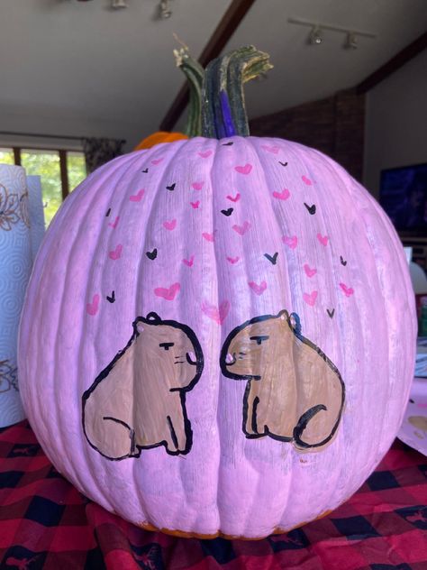 Halloween pumpkin painted pink with two capybaras facing each other Capybara Pumpkin Carving, Capybara Pumpkin, Corgi Pumpkin Painting, Pig Pumpkin Painting, Guinea Pig Pumpkin Carving, Easy Capybara Painting, Capybara Halloween, Pumpkin Paint, Pumpkin Cravings