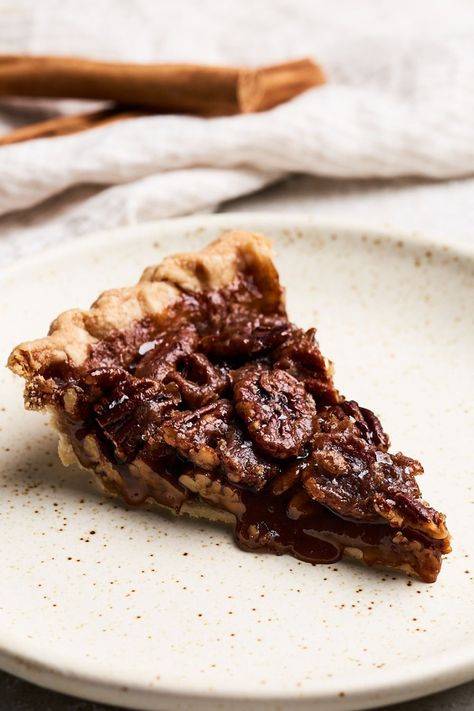 This vegan pecan pie comes together with just 10 ingredients, most of which are pantry staples! Made without eggs or corn syrup, it has a rich, crunchy, caramel-like filling with a perfectly flaky crust. It bridges the gap between plant-based treats and classic holiday favorites in an unbelievably delicious way. #veganpecanpie #pecanpie #vegandesserts Eggless Pecan Pie, Vegan Peach Cobbler, Best Pecan Pie Recipe, Crunchy Caramel, Vegan Pecan Pie, Vegan Pecan, Best Pecan Pie, Vegan Peanut Butter Cookies, Vegan Cookie Dough