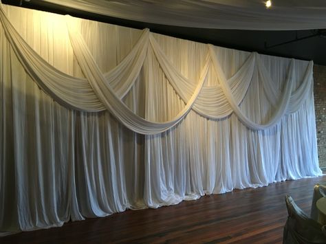 Fabric Wall Draping, Chiffon Wall Draping, Drapery Decor Wedding, Wall Drapping Ideas, Draped Fabric On Wall, Draping Fabric On Walls, Fabric Draping Techniques, Leslie Core, Draping Wedding Reception