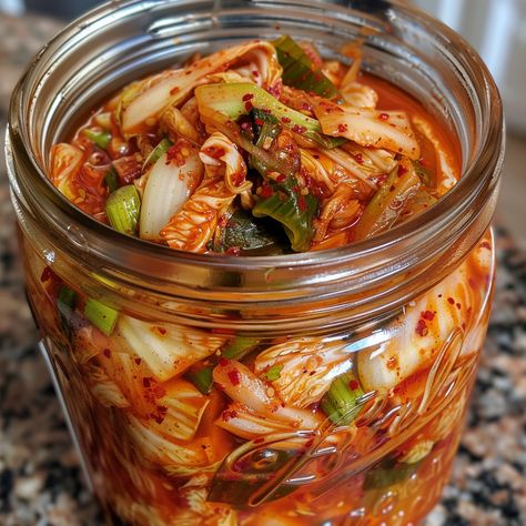 Homemade kimchi not only allows for customization of flavors and ingredients but also provides numerous health benefits due to its natural fermentation process. Homemade Kimchi Recipes, What To Eat With Kimchi, Diy Kimchi, Green Cabbage Kimchi Recipe, Kimchi Ingredients, Kimchee Recipe, Fresh Kimchi, Fermented Recipes, Green Pepper Recipes