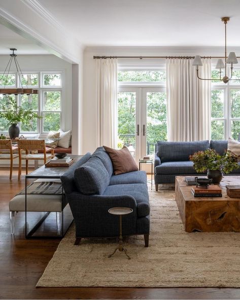 Living room with two deep blue sofas. A big area rug underneath a wooden coffee table. Wall of windows. Family Friendly Living Room, Cozy Living Spaces, Spacious Living Room, Living Room Inspo, Cozy Living Rooms, A Living Room, Cozy Living, Living Room Inspiration, House Inspiration