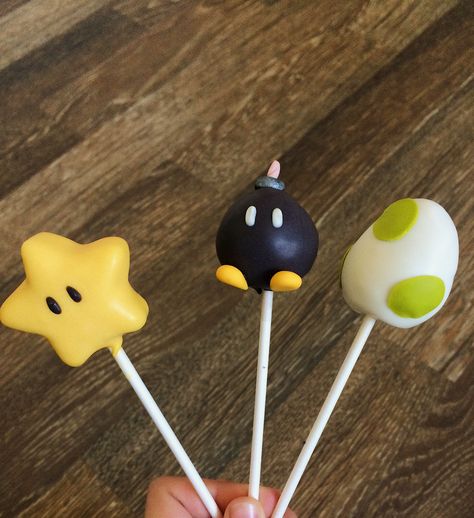 Super Mario Bro Treats, Super Mario Bros Dessert Ideas, Yoshi Cake Pops, Fondant Cake Pops, Mario Kart Cake Pops, Yoshi Egg Cake, Video Game Cake Pops, Super Mario Cakesicles, Super Mario Cake Pops