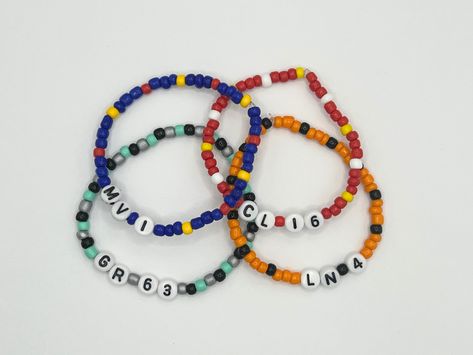 Get ready for the 2024 F1 season with our Formula 1 Friendship Bracelets! All bracelets feature a driver's initials and number surrounded by beads in their team colours. Currently available are Red Bull, Ferrari, Mercedes, and McLaren. More to come soon! The perfect gift for any F1 fan! Bracelets are 17cm long and made with stretchy elastic cord. All bracelets are made to order and will be dispatched within 3 days by Royal Mail Second Class. Red Bull Bracelet, Ferrari Friendship Bracelet, Lando Norris Bracelet Ideas, Formula 1 Friendship Bracelet, Mclaren Bracelet, F1 Friendship Bracelet, F1 Bracelet Ideas, Formula 1 Bracelet, F1 Bracelet