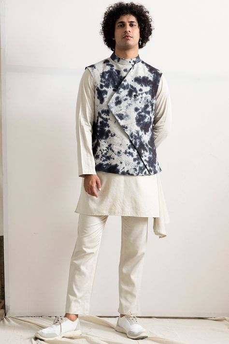 Featuring a white long kurta in bamboo blend base with side seams. It is paired with matching linen pants and a quilted bundi jacket having tie-dye. NOTE: As it is hand tie-dye, the print may slightly vary.  FIT: True to size. COMPOSITION: Bamboo blend, Linen. CARE: Dry clean only. Batik Fashion Pria, Stylish Boy Clothes, White Kurta, Nehru Jacket, Batik Fashion, Nehru Jackets, Fashion Pria, Stylish Mens Outfits, Indian Fashion Designers