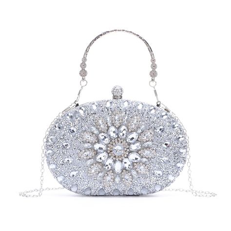 PRICES MAY VARY. ❤ Materials: the luxury clutches bag is made of beautiful rhinestones crystal and Smooth Pu Leather. Exquisite crystal ball clasp, stylish acrylic diamond sunflowers design in center, detachable chain and handle, used as clutch bag, evening bag, tote bag and crossbody bag. ❤ Features: generous, elegant, versatile, practical, the noble temperament are the core beauty of this bag. The exquisite and elegant style made you attracts lots of admiring glances. ❤ Perfect Capacity: bling Silver Clutch Purse, Party Handbags, Luxury Clutch, Rhinestone Material, Silver Clutch, Rhinestone Clutch, Crystal Clutch, Wedding Clutch, Party Purse