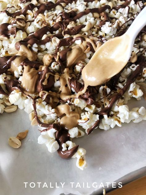 Popcorn covered in melted chocolate and a spoon with melted peanut butter. Chocolate Peanut Butter Popcorn Balls, Popcorn Chocolate Drizzle Recipes, Popcorn Drizzled With Chocolate, Tailgate Snack, Drizzled Popcorn, Reese’s Pieces Popcorn, Chocolate Peanut Butter Popcorn, Popcorn Recipes Sweet, Peanut Butter Shake