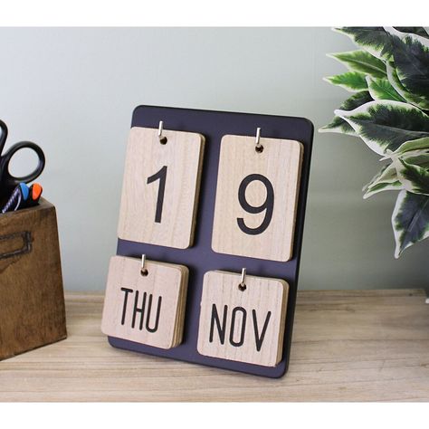 A perpetual calendar that will look perfect on a desk or worktop, with wooden day, date and month boards on a black photoframe style board. Made of MDF with iron hooks. Measurements: 14 x 20 x 17cmFeatures:A perpetual calendar that will look perfect on a desk or worktop, with wooden day, date and month boards on a black photo frame style board.Made of MDF with iron hooks.Measurements: 14 x 20 x 17cmProduct Type: Calendar BoardSubject: TextSurface Material: Manufactured WoodFramed: NoFrame Materi Photo Frame Style, Wooden Calendar, Calendar Board, Summer Furniture, Selling Photos, Ceramic Canister, Perpetual Calendar, Memo Board, Arte Popular