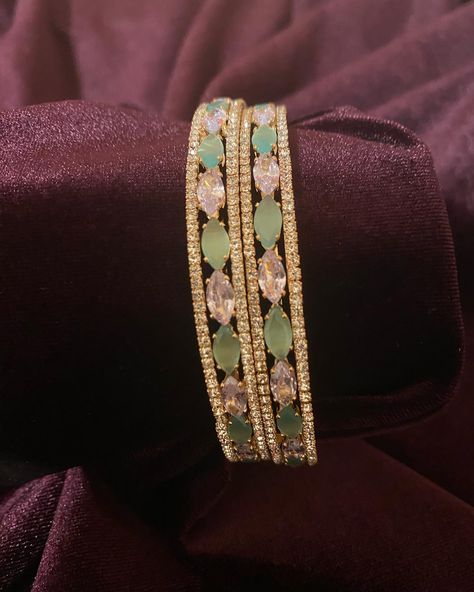 CZ American Diamond Bangles. Free shipping across USA. Shop Now !! Website-www.jayashreetraditions.com #fashionjewellerysale #kundan #viraljewelry #bridaljewellery #americandiamondjewellery #americandiamondearrings #bridalmakeup #bridalinspiration #TempleCollection #NecklaceSets #nakshicollection #asianbridalmakeup #goldalikenecklace #weddingjewelry #bridaljewelry #imitationjewelry #jayashreetraditions #bayareawedding #bridalcouture#wedmegood #sanjoseindianwedding #bayareaindianwedding #czje... Mint Green Design, Green Bangles, Asian Bridal Makeup, American Diamond Jewellery, Expensive Jewelry Luxury, Bridal Choker, Green Stones, Stone Bangle, Jewelry Luxury