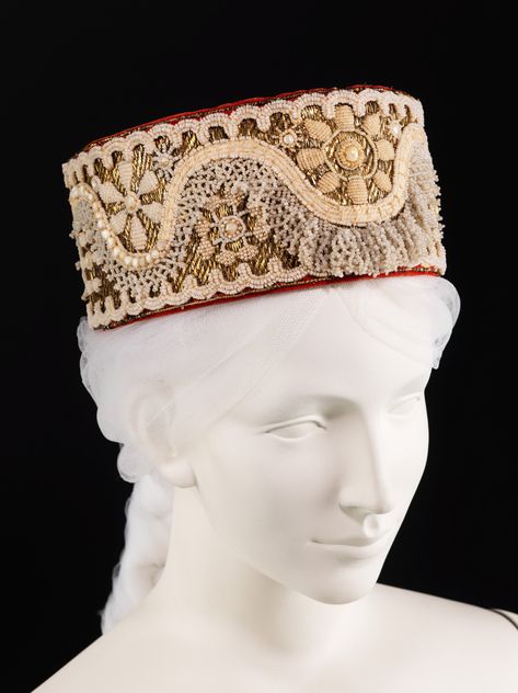 early 19th c.Headdress Russian The Met. glass,metal,cotton,mother-of-pearl.This object is from the collection of Natalia de Shabelsky (1841-1905),a Russian noblewoman compelled to preserve what she perceived as the vanishing folk art traditions of her native country.Those from the North were embellished with the river pearls that were plentiful in that area while goose down and woolen embroideries were more popular in the South. Russian Clothing, River Pearls, Wedding Headdress, Russian Culture, Russian Folk, Folk Dresses, Costume Collection, Russian Fashion, Gold Embroidery