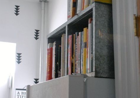 Steel bookcase on its side above the fridge to hold cookbooks--clever solution and use of that awkward space above the fridge. Organize Cookbooks, Space Above Refrigerator, Above Refrigerator Storage, Above Refrigerator Ideas, Space Above Fridge, Above Fridge Ideas, Above Fridge Storage, Storage Above Fridge, On Top Of Fridge