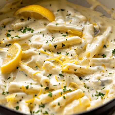 Rich and creamy lemon garlic sauce with Parmesan cheese, perfect for pasta or vegetables. Ready in just 20 minutes! Sauce For Lemon Ricotta Ravioli, Lemon Pepper Alfredo, Creamy Lemon Parmesan Sauce, Lemon Garlic Butter Cream Sauce, Light Creamy Pasta Sauce, Lemon Parmesan Cream Sauce, Easy Lemon Butter Sauce Pasta, Lemon Herb Ricotta Pasta Sauce, Lemon Ravioli