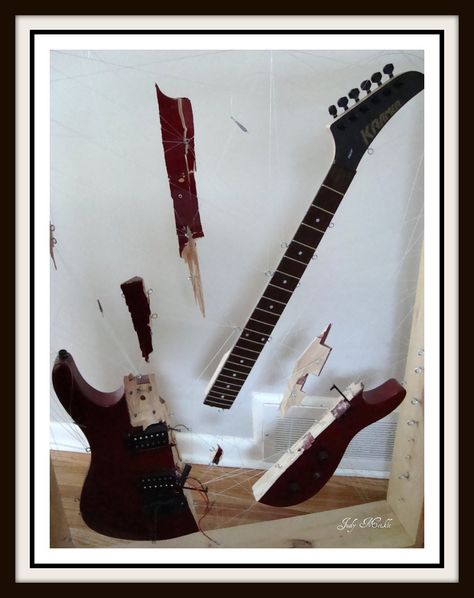 A smashed guitar Smashed Guitar, Smashing Guitar, Guitar Smash, Surrealism Fashion, Broken Guitar, Distortion Art, Afro Latina, Red Rain, Guitar Art