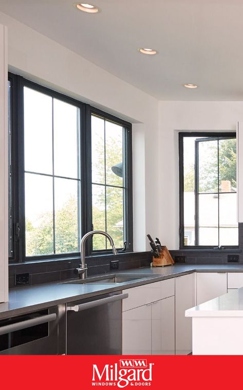 Striking black windows are the new trend for kitchens. The sleek black frame complements a modern design. Featuring: Ultra™ Series fiberglass windows. See how this home with old-world charm got a contemporary new look.#kitchenwindowideas #blackwindowframes#trendinghomedec#kitchenwindows Milgard Ultra Black Windows, Hawaii Kitchen, Classic Farmhouse Kitchen, Rehab Addict, Glass Wall Systems, Kitchen Window Design, Black Window Frames, Fiberglass Windows, Contemporary Windows