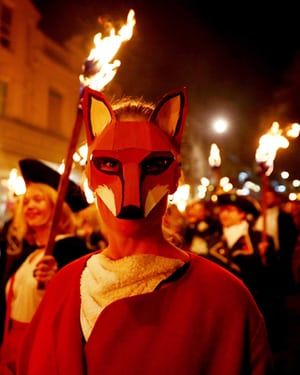 A fox–masked parade attendee is illuminated by the flames in Lewes    Elena Goodinson 11/4/2017  The Guardian Lewes Bonfire Night, Low Poly Mask, Pied Piper, Celtic Culture, Bonfire Night, East Sussex, British Isles, The Guardian, Wearable Art