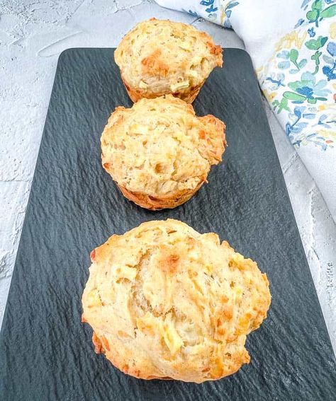 3 Apple Cheddar Muffins on a black plate. Apple Cheddar Muffins, Apple Chunk Muffins, Grated Apple Muffins, Honeycrisp Apple Muffins, Jumbo Apple Walnut Muffins, Apple And Cheddar, Muffins Apple, Cheddar Muffins, Pear Muffins