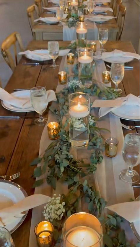 Greenery, floating candles, simple tie knot napkins One Long Wedding Dinner Table, Wedding Table Set Up Rectangle, Wedding Centerpieces Flameless Candles, Simple Outdoor Table Centerpieces, Wedding Table Centerpieces For Long Tables, Floating Candles Tablescape, Birthday Party Table Decorations Elegant, Rectangle Wedding Table Decor Candles, Simple Wedding Table Settings Rectangle