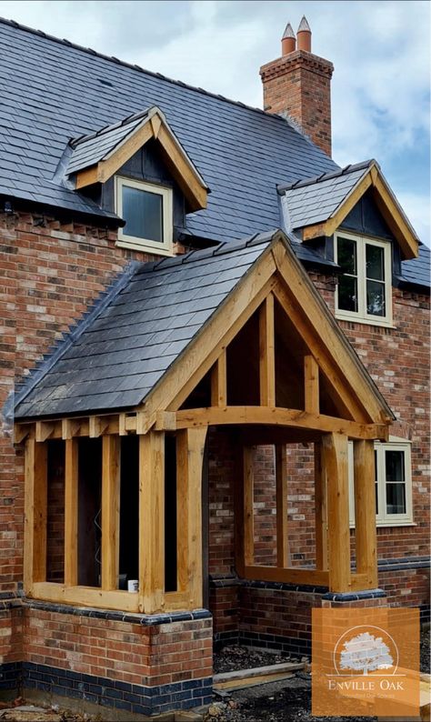 Enville Oak Ltd had the pleasure to manufacture and install this beautiful Solid Oak Frame Porch, and what a grand entrance to the house it is Manufactured in house at our workshop in the heart of the Enville Estate, our bespoke Oak Frames are handmade to order and built to last. If you have plans for an Oak Frame it would be great to hear from you and discuss your requirements however big or small your project may be. www.envilleoakltd.com | info@envilleoakltd.com | 01384 210 289 Oak Porch Ideas, Oak Beam Porch, Oak Frame Porch Entrance, Oak Front Door Canopy, Oak Frame Porch, Entrance To The House, Welsh Oak Frame House, Oak Porch, Timber Frames