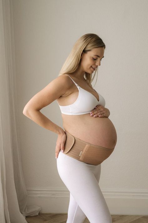 Pregnant woman wearing the Ease Maternity Support Belt, designed to relieve back and pelvic pain during pregnancy Maternity Belly Band, Pregnancy Belly Band, Pregnancy Belly, Maternity Belt, Belly Support, Growing Belly, Pelvic Pain, Stay Active, Pregnant Belly