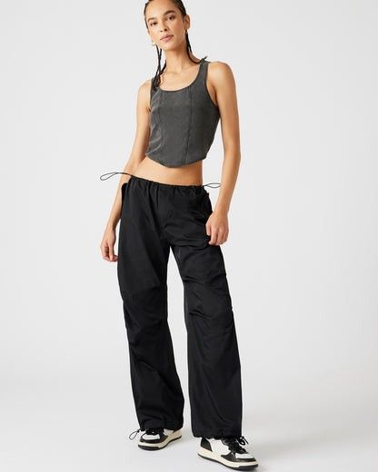 Discover the ultimate blend of style and comfort with PIA Parachute Pants in Black. Perfect for any occasion, these versatile pants feature a sleek design with functional pockets and an adjustable waistband for a custom fit. Ideal for casual wear or a chic, street-ready look. Shop now for a timeless addition to your wardrobe. Adjustable Pants, Parachute Pant, Steve Madden Store, Casual Pant, Side Snap, Apparel Merchandising, Casual Wide Leg Pants, Easy Trendy Outfits, Low Iron