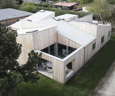 Sigurd Larsen's Roof House features intersecting slanted roofs Modern Roof Design, Modern Wood House, Shed Roof Design, Wood House Design, World Architecture Festival, House Roof Design, Roof House, Awesome Architecture, Roof Architecture